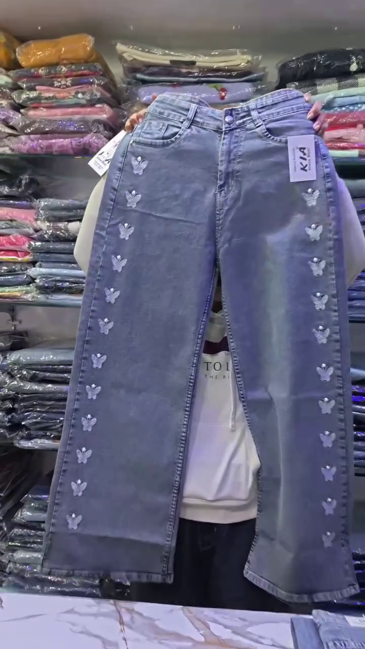 Elegant Pink Printed Peplum Top Styled with White Wide-Leg Trousers