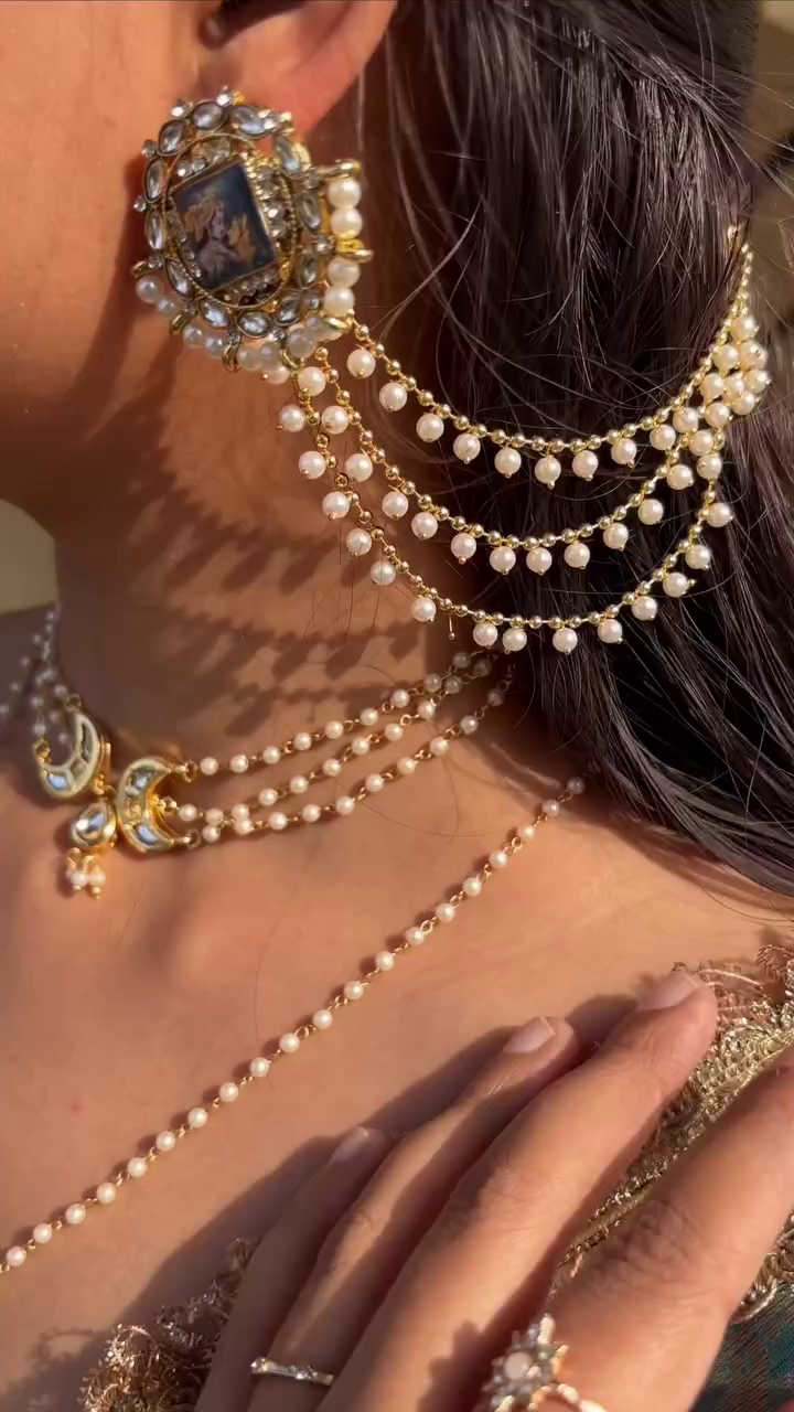 Regal Pearl Chain Earrings with Vintage Portrait Detailing