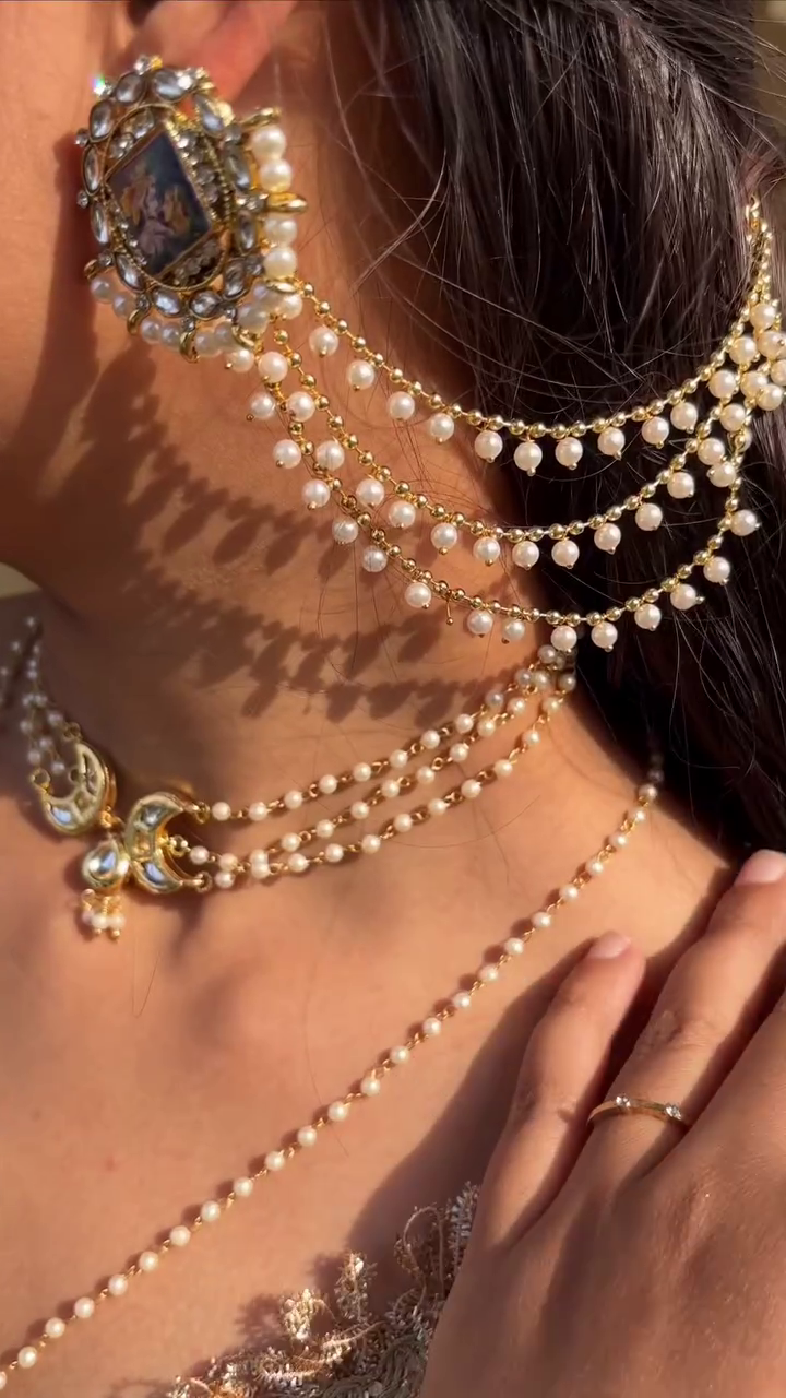 Regal Pearl Chain Earrings with Vintage Portrait Detailing