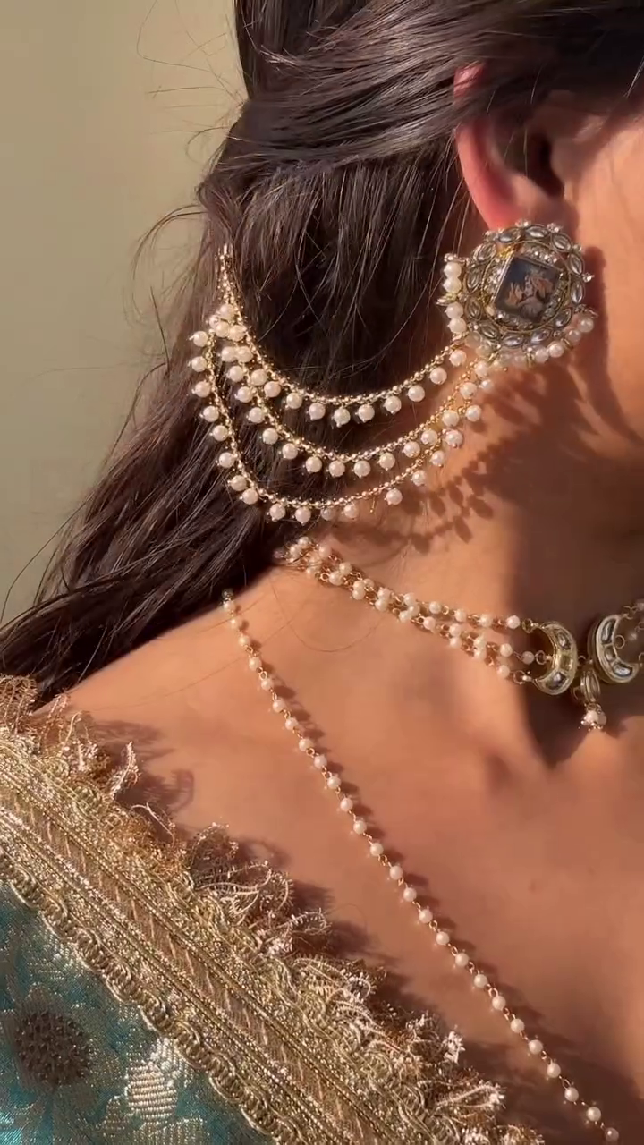 Regal Pearl Chain Earrings with Vintage Portrait Detailing